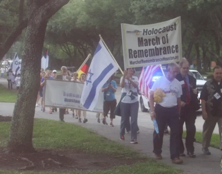holocaust march of remembrance concludes with dedication of memorial garden